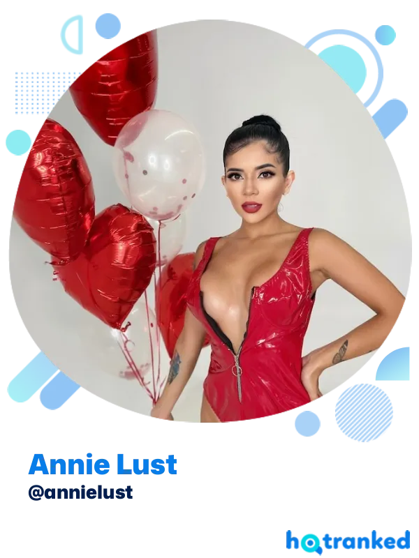 Annie Lust wearing a red outfit with balloons in the background