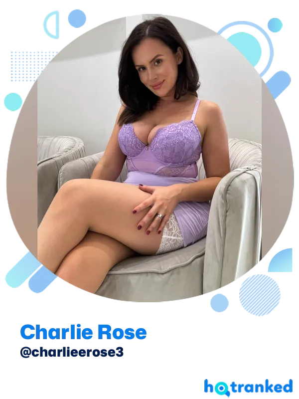 Charlie Rose sitting elegantly in lavender lingerie