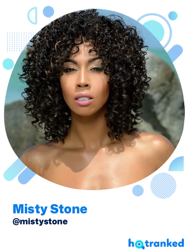 dark creator Misty Stone with curly hair and radiant smile