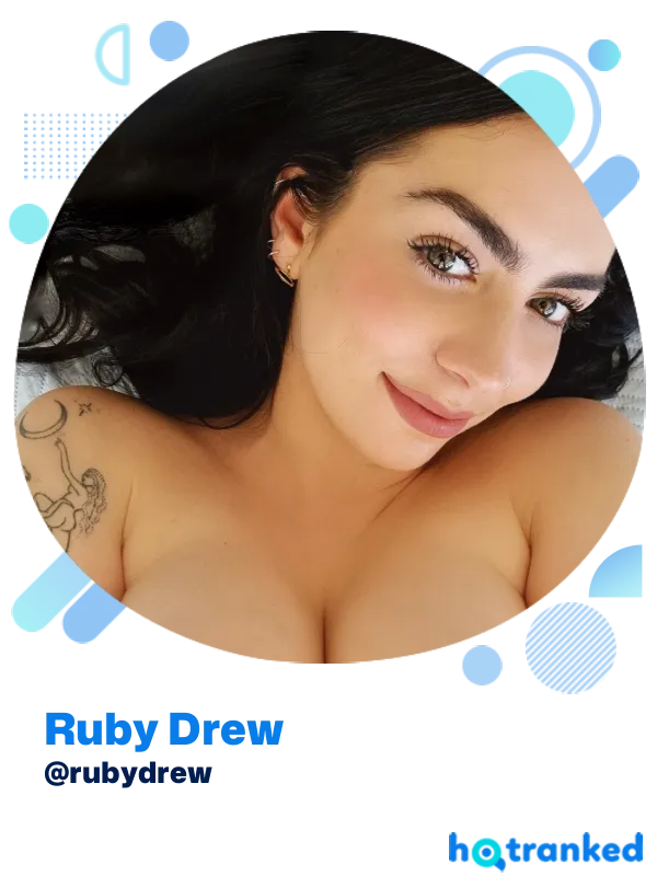 close-up smiling Ruby Drew with tattooed arm