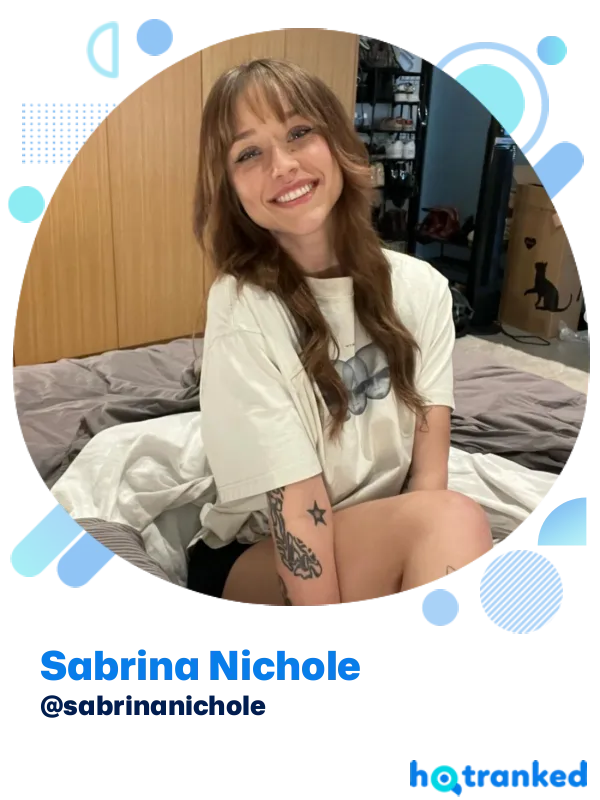smiling woman with tattoos and brown hair Sabrina Nichole