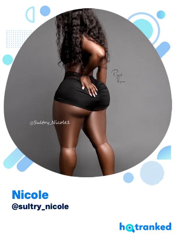 afro performer Nicole modeling black skirt with a sultry stance